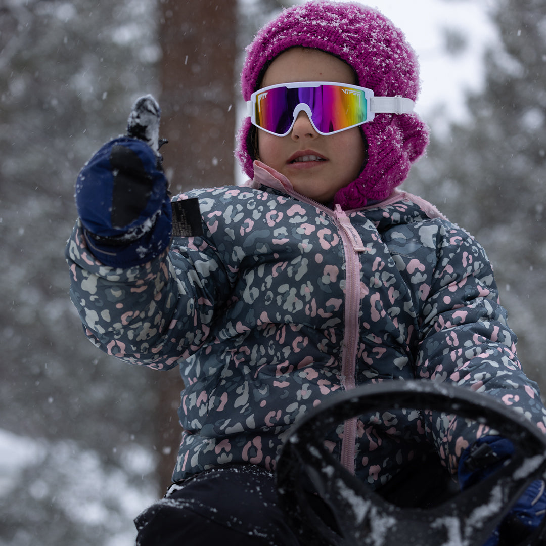 Baby in the snow wearing The Miami Nights Baby Vipes from Pit Viper Sunglasses