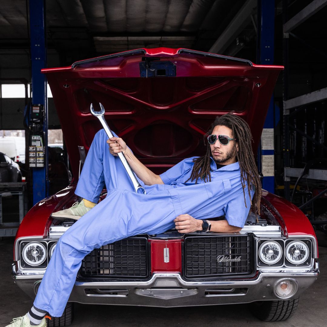 Man holds large wrench while wearing The Marissa’s Nails Jethawk with a Polarized Smoke lens from Pit Viper Sunglasses
