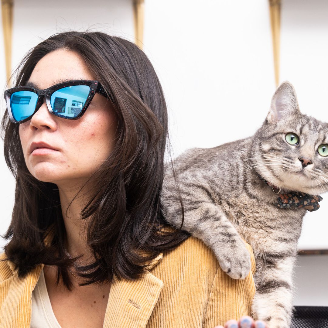 Woman wears The Midnight Clawdia with a blue lens from Pit Viper
