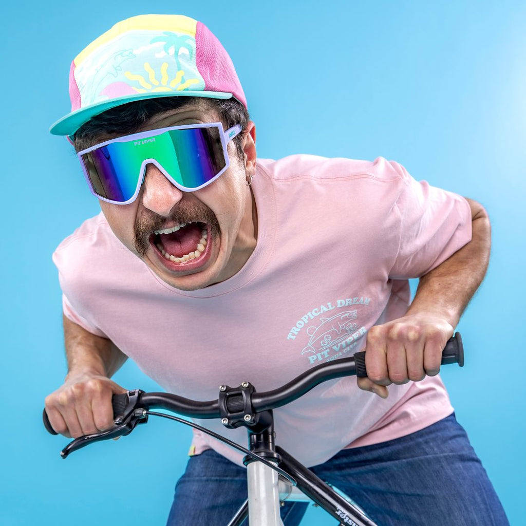 Man rides bike wearing The Moontower Try-Hard from Pit Viper Sunglasses