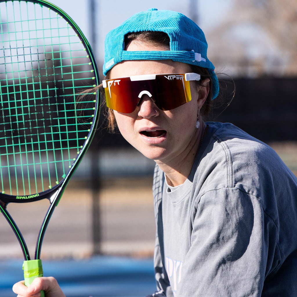 Person wearing The Miami Nights Original 2.0 with HDPV Polarized Rainbow lens