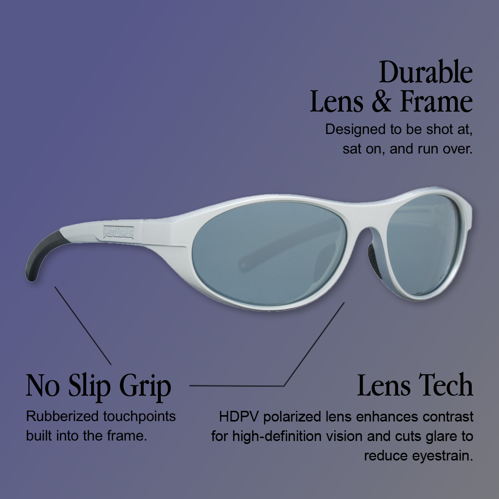 Infographic for Pit Viper Altimeter HDPV Polarized sunglasses showing a white-frame pair of sunglasses in three-quarter side view with silver-gray polarized lenses and a PIT VIPER logo embossed on the temple, with 3 callouts: 'Durable Lens & Frame - Designed to be shot at, sat on, and run over.', 'No Slip Grip - Rubberized touchpoints built into the frame.', 'Lens Tech - HDPV polarized lens enhances contrast for high-definition vision and cuts glare to reduce eyestrain.'