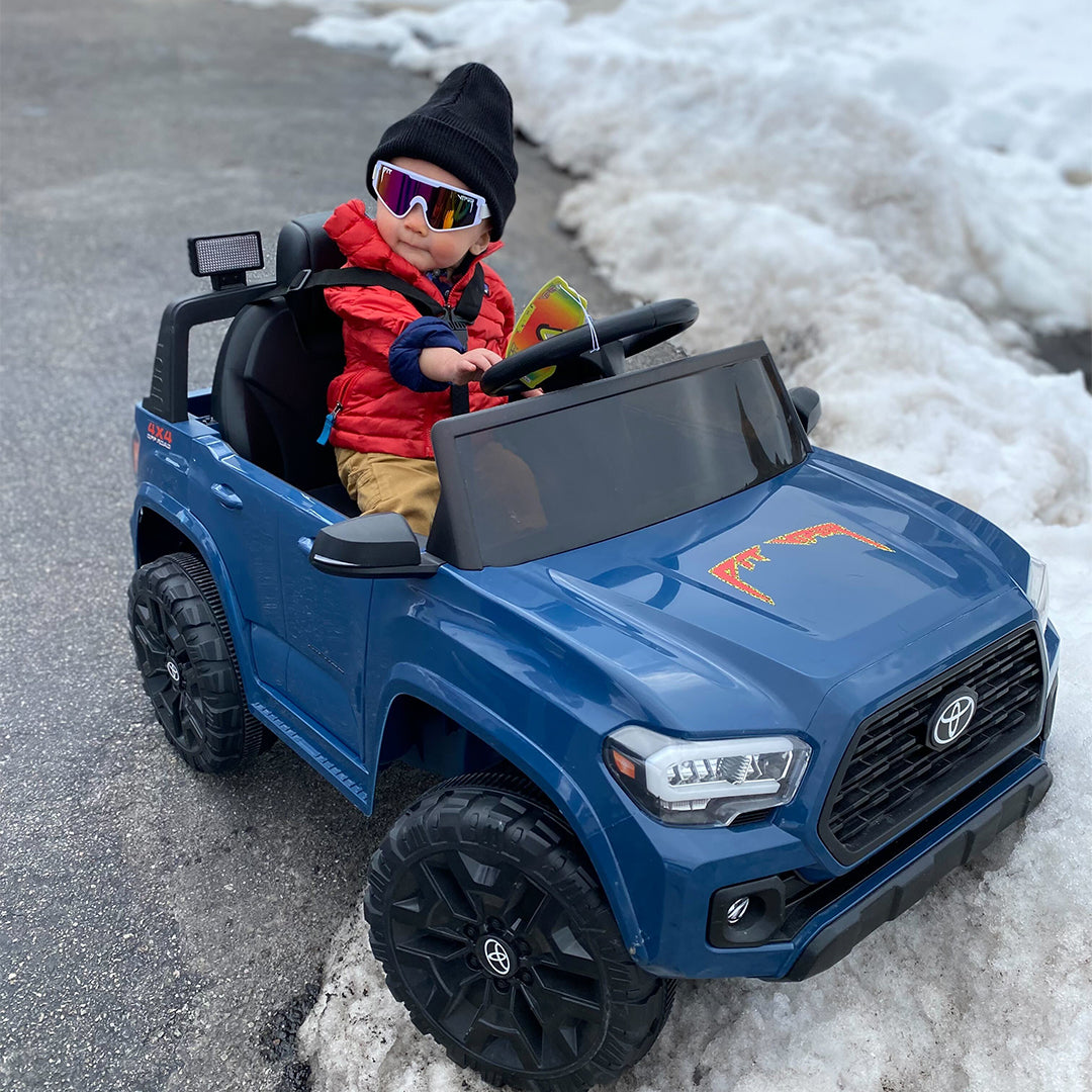 Baby driving a kids car in The Miami Nights Baby Vipes from Pit Viper Sunglasses