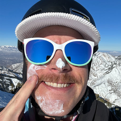 Man putting sun screen on wearing Pit Viper Sunglasses