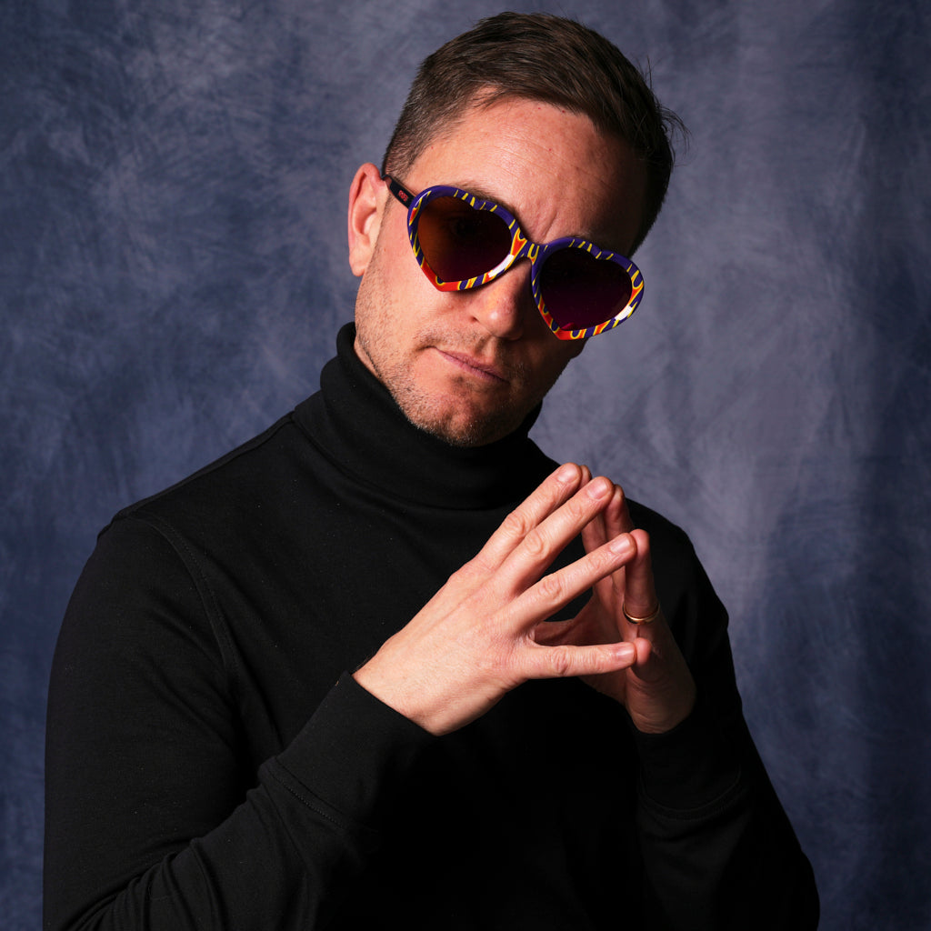 very important businessman wearing a turtleneck and heart-shaped sunglasses
