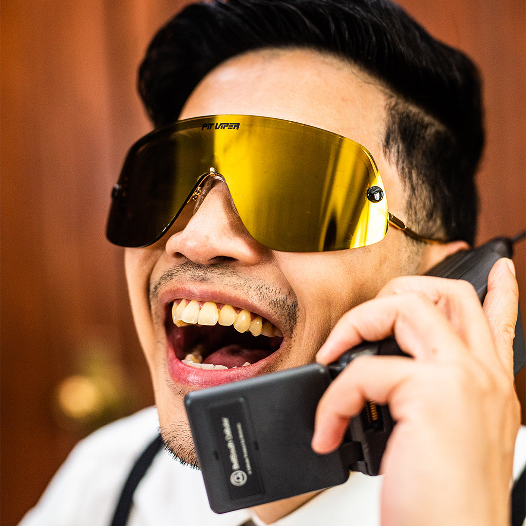 Person wearing The Money Counter Limousine with polarized Gold lens