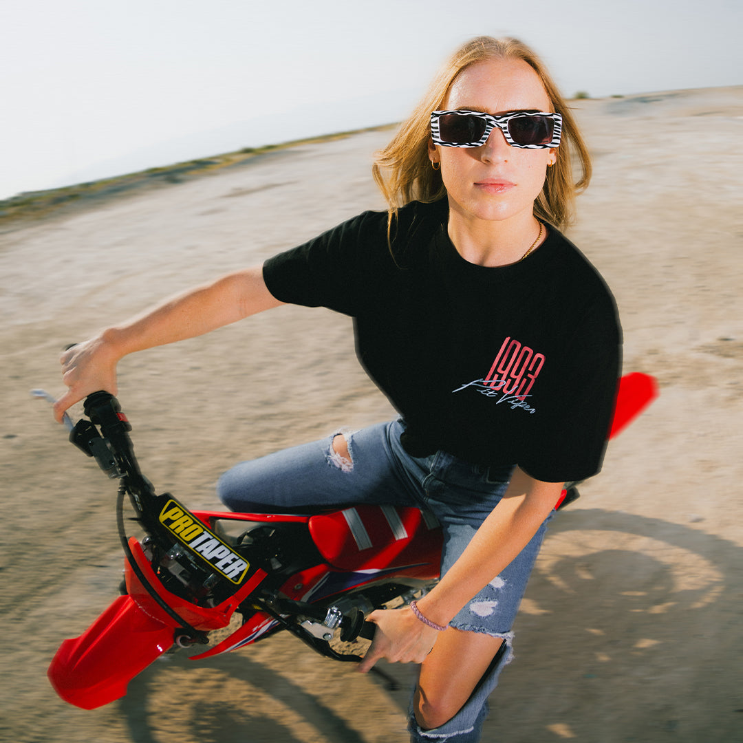 Person wearing The Herbivore Low Bones sunglasses