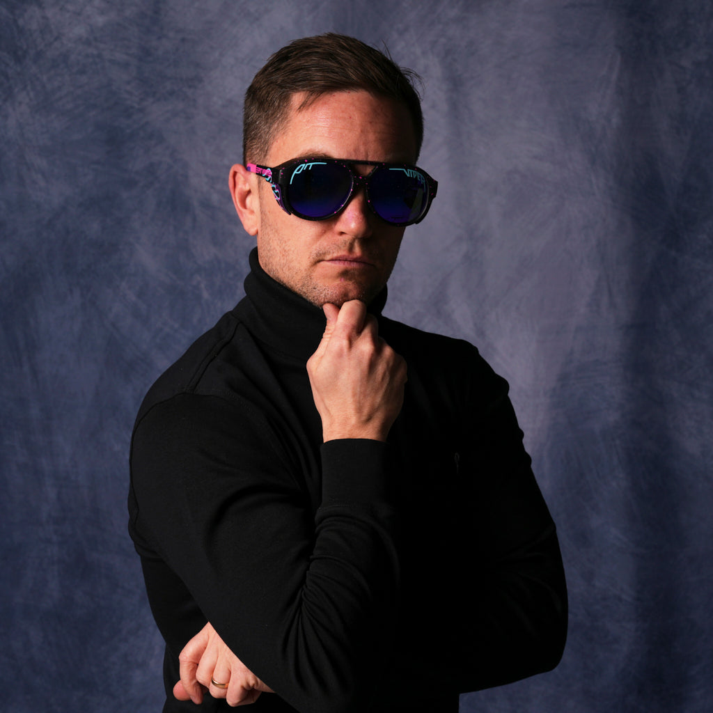 A very important businessman wearing The Ignition Exciters with a Polarized Z87+ Purple lens from Pit Viper Sunglasses