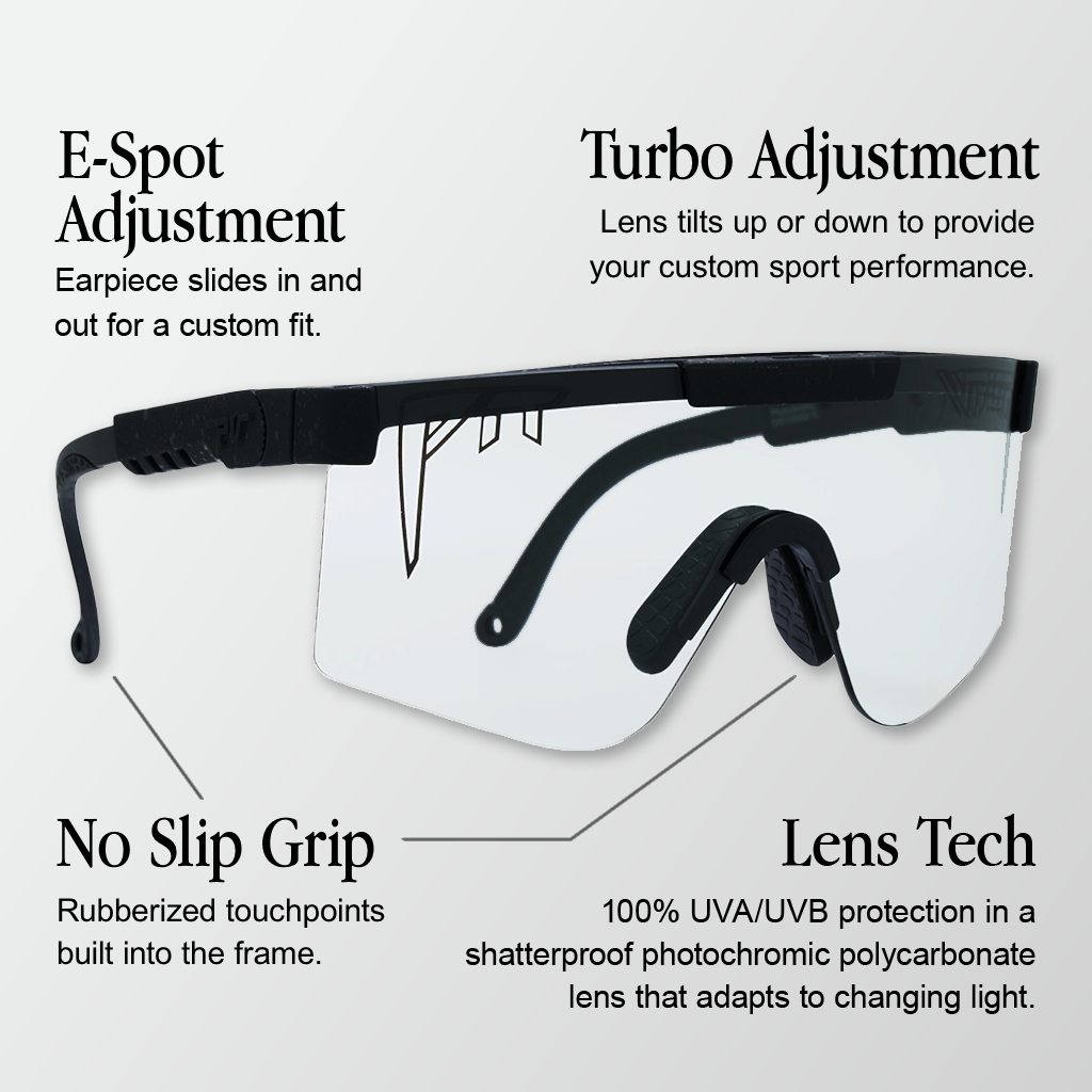 Infographic for Pit Viper Original Photo sunglasses with 4 callouts: 'E-Spot Adjustment - Earpiece slides in and out for a custom fit.', 'Turbo Adjustment - Lens tilts up or down to provide your custom sport performance.', 'No Slip Grip - Rubberized touchpoints built into the frame.', 'Lens Tech - 100% UVA/UVB protection in a shatterproof photochromic polycarbonate lens that adapts to changing light.'