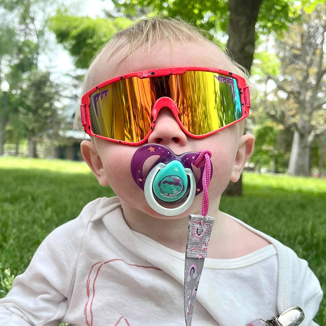 Baby with a passafire in The Radical Baby Vipes from Pit Viper Sunglasses
