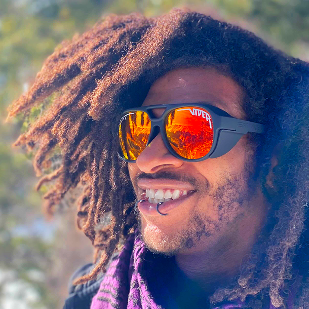 Person wearing The Exec Exciters sunglasses