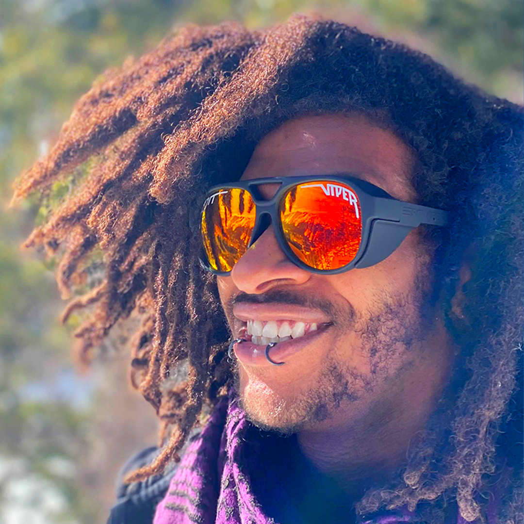Person wearing The Exec Exciters sunglasses
