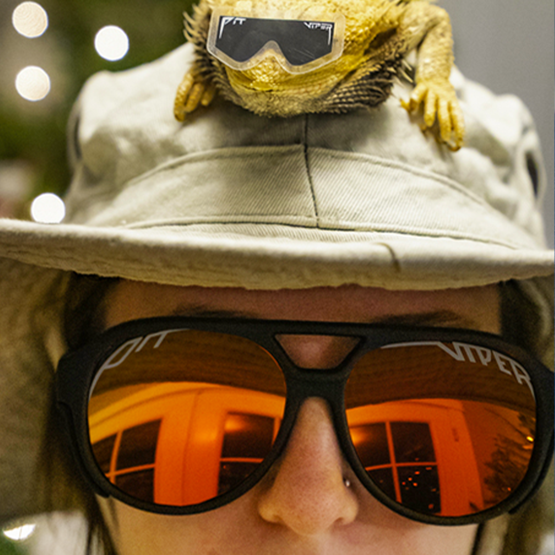 Person wearing The Exec Exciters sunglasses
