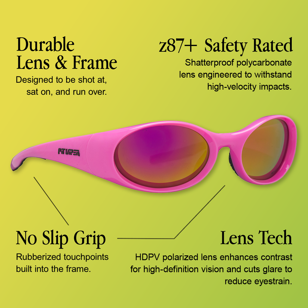Infographic for Pit Viper Slammer sunglasses in an HDPV polarized colorway with 4 callouts: 'Durable Lens & Frame - Designed to be shot at, sat on, and run over.', 'z87+ Safety Rated - Shatterproof polycarbonate lens engineered to withstand high-velocity impacts.', 'No Slip Grip - Rubberized touchpoints built into the frame.', 'Lens Tech - HDPV polarized lens enhances contrast for high-definition vision and cuts glare to reduce eyestrain.'